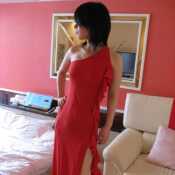 A Japanese girl put on a red dress. 