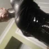 Latex Submissive in steel restraints