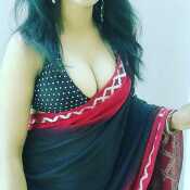 Wearing traditional Bengali attire with a rather revealing blouse....