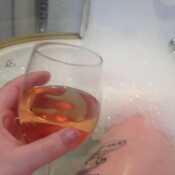 Chilling in a bubble bath with wine