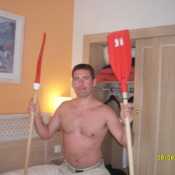 Me on the bed with a couple of oars 