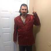 Red silk loius Vuitton jacket smiling like Greddy evil ??